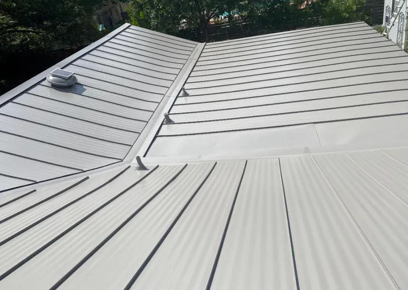 Solar attic fan installed on a metal roof for Roof Ventilation in Mountain View